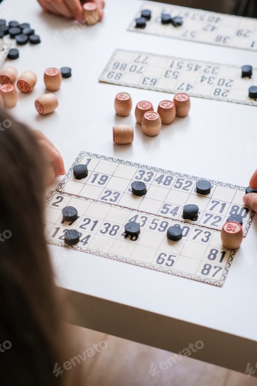 Vista previa: Two children are playing board games. Lotto Bingo Game set. Cozy home. Joy and fun. Play time.