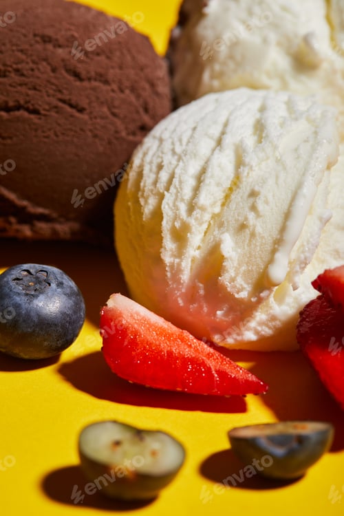 Preview: close up view of tasty brown and white ice cream with berries