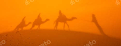 Preview: Shadow of a caravan on sand dunes