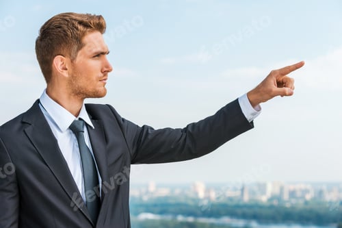 Preview: Businessman pointing away.