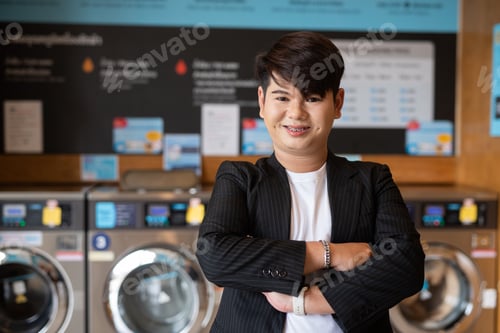 Preview: Young cute gay man in laundry shop