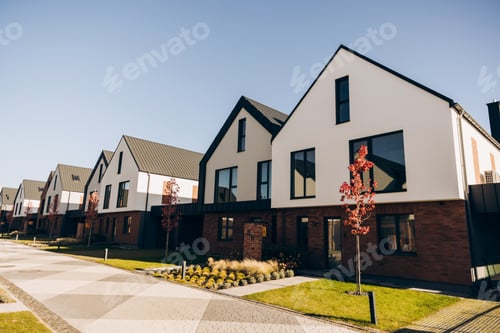 Preview: Modern suburban townhouses lining a street on sunny day