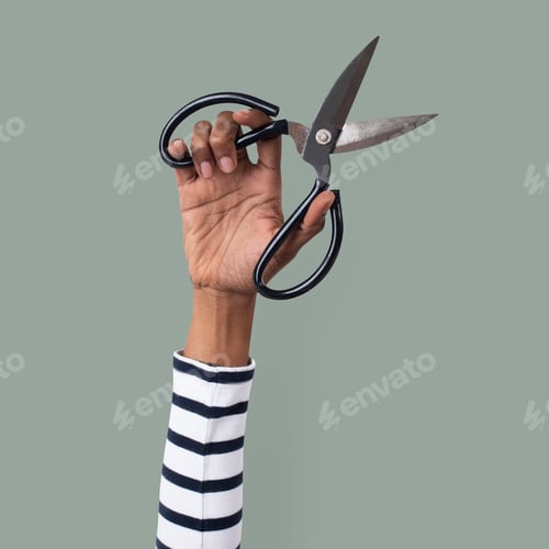 Preview: Gardening tool scissor held by a woman's hand