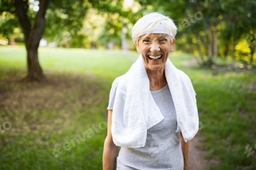 Preview: Smiling Senior Woman Exercising Outdoors in the Park