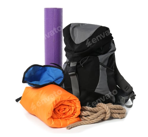 Preview: Sleeping bag, backpack and camping equipment on white background