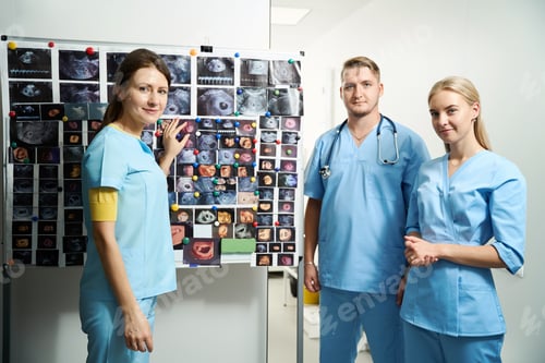 Preview: Clinic team during exploring ultrasound photos of pregnant woman belly