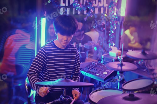 Preview: People playing drums playing live music in a pub house.