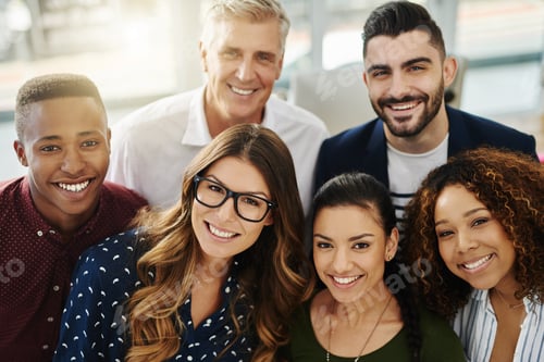 Preview: Portrait of a group of confident businesspeople standing together in an office