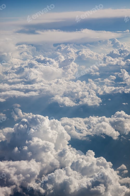 Preview: Fluffy white clouds, a view from airplane window