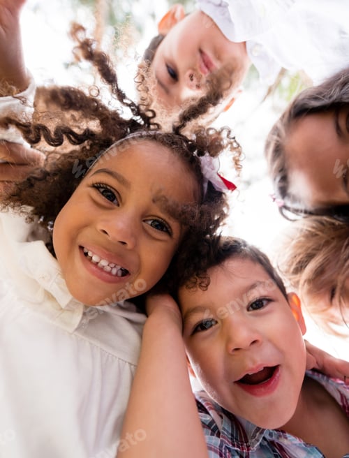 Preview: Happy Group Of Kids Hugging At The Park