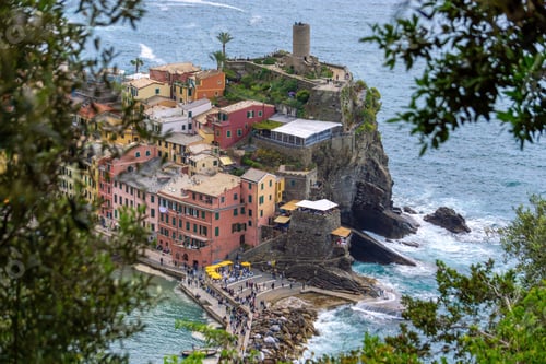 Preview: Scenic view of Monterosso al Mare beach with vibrant blue water and historic buildings in Italy
