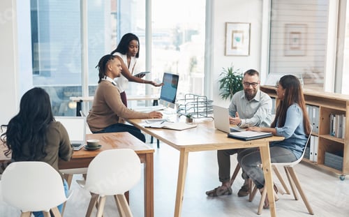 Preview: Full length shot of a diverse group of businesspeople working in the office during the day