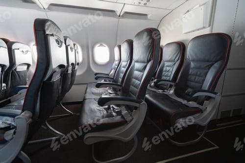 Preview: Airplane seats and windows. Economy class comfortable seats without passengers