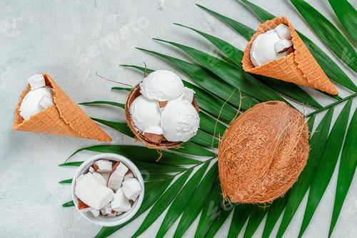 Preview: Top view of coconut ice cream waffle cones on grey background.