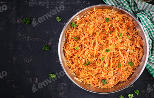 Preview: Stewed cabbage on the dark background in rustic style. Top view, flat lay
