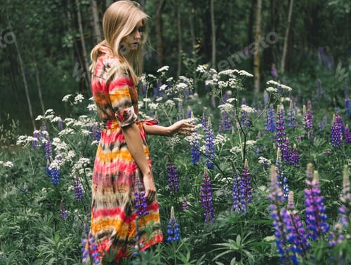Preview: Blonde Woman Wearing Dress Among Wildflowers in Woods
