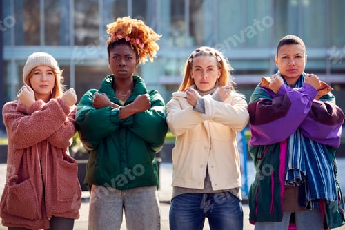 Preview: Portrait Of Female Protestors With Arms Crossed On Demonstration March
