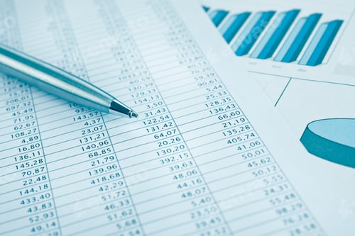 Preview: Business data report print and pen close up. Blue toned.