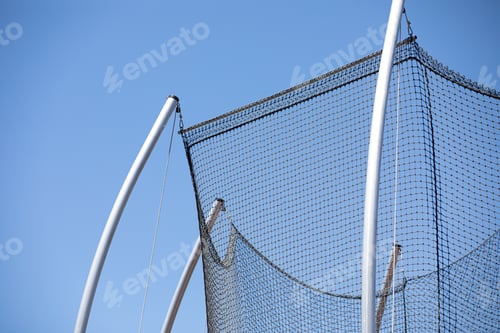 Preview: Low angle shot of a net for an athletics hammer throw event