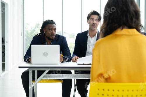 Preview: Job interview. Diverse hr team doing job interview with a woman in business office. Human Resources