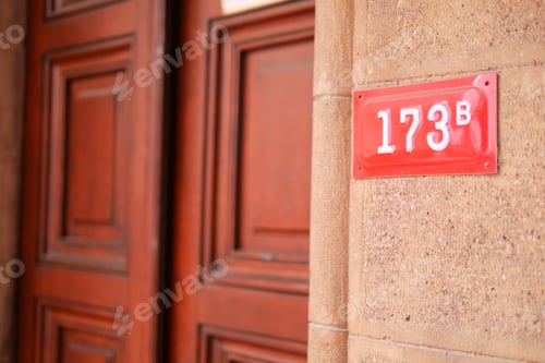 Preview: house number. Decorative lettering on a brick wall.