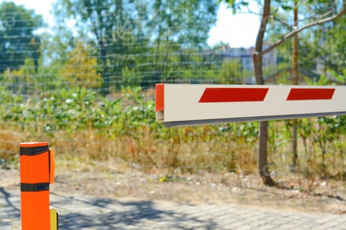 Preview: Closed boom barrier on sunny day outdoors