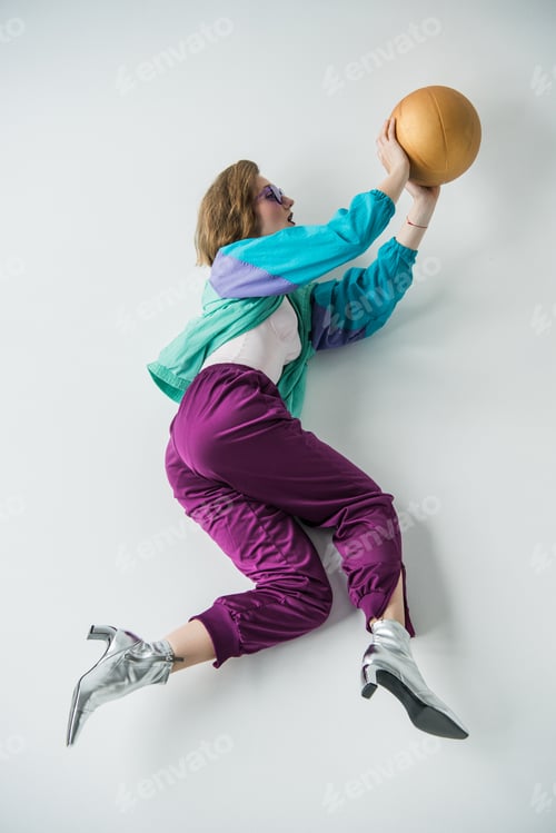 Preview: stylish woman in vintage style clothing holding ball isolated on grey