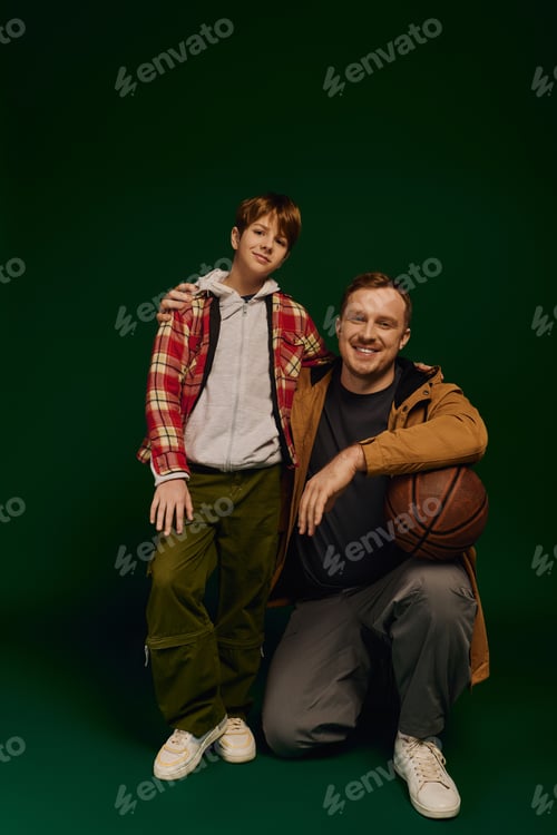 Preview: Joyful moments shared between father and son in a stylish studio setting