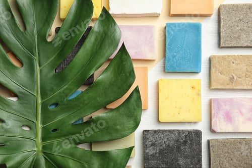 Preview: Flat lay composition with handmade soap bars on color background