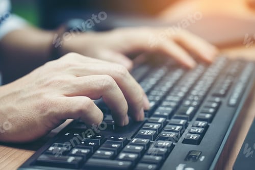 Preview: Close-up of typing male hands on keyboard.