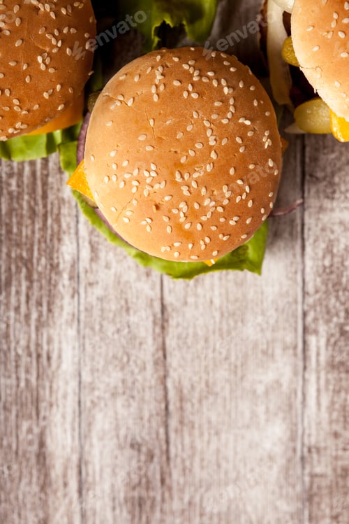 Preview: Delicious home made snack burgers on wooden plate