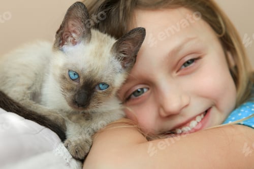 Preview: Closeup of Young Girl with Siamese Kitten