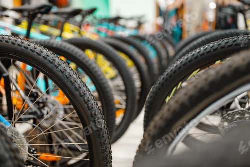 Preview: Rows of cycles in sports shop, focus on wheels