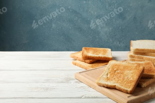 Preview: Board with toasts on white wooden background, space for text