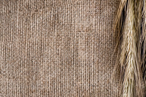Preview: close up view of wheat on sackcloth background