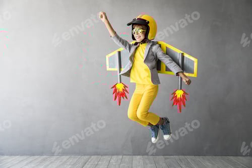 Preview: Happy child playing with toy jetpack