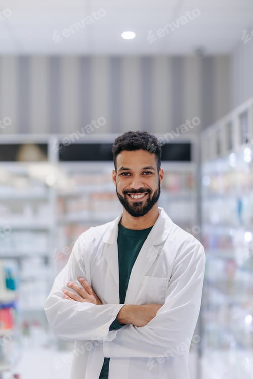 Preview: Portrait of young multiracial pharmacist looking at camera, standing in a pharmacy shop.