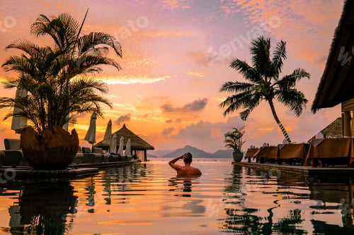 Preview: Luxury swimming pool in tropical resort, relaxing holidays in Seychelles islands