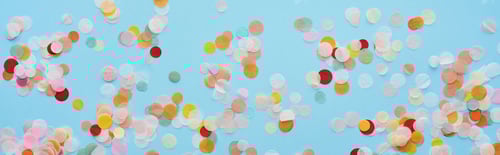 Preview: panoramic shot of multicolored confetti on blue