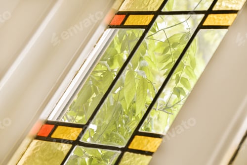 Preview: a stained glass window with plants in it