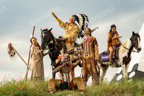 Preview: cowboy on his horse during the run of the horses in background