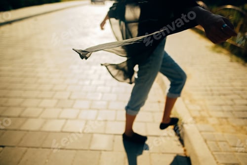 Preview: Stylish hipster girl walking in sunny light in street, atmospheric moment