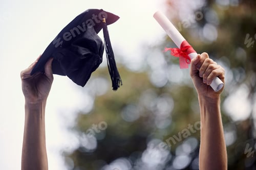 Preview: Closeup shot of an unrecognisable graduate holding their cap and diploma on graduation day