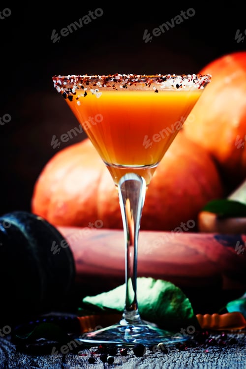 Preview: Fresh pumpkin juice in glass on a dark Halloween background, selective focus