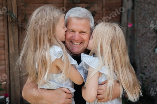Preview: Happy father with his daughters