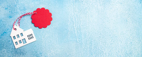 Preview: House for buy or rent label on winter holidays. Wooden house symbol with tag on blue background