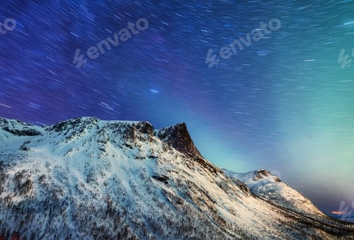 Preview: Norther lights and stars, Senja island, Norway. Landscape at the night time