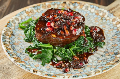 Preview: Cod with sorrel and pomegranate butter sauce. French gourmet cuisine