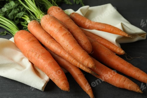 Preview: Kitchen towel with carrot on dark wooden background