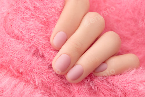 Preview: Womans hand with trendy pink matte manicure close-up. Beauty treatment spa body care
